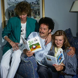 Bobby Ball and family at home with books September 1988