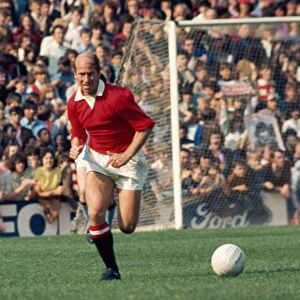 Bobby Charlton in action for Manchester United during a league division one match gainst