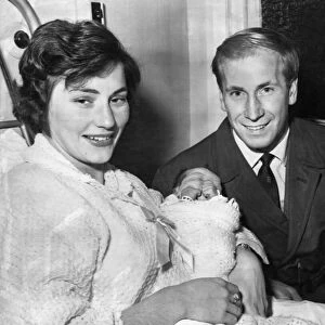 Bobby Charlton, football player for Manchester United, smiles proudly with his wife Norma