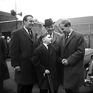 Bobby Charlton, of Manchester United, meets young fan Leslie Ripley of Barking