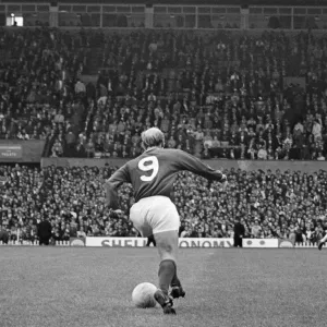 Bobby Charlton, in the number 9 shirt for Manchester United, at Old Trafford