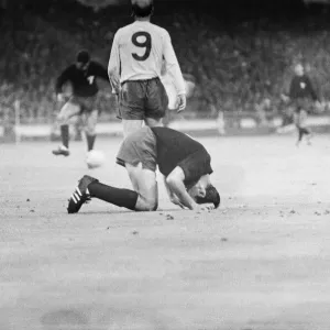 Print of Bobby Charlton walking away from a fallen Gustavo Pena