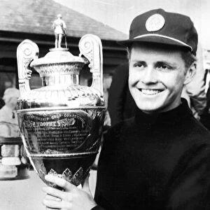 Bobby Cole South African Golfer holding the British Amateur Golf Trophy in 1966