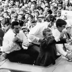 Bobby Moore holds up the FA Cup on the coach as the team return with Johnny Byrne Bobby Moore holds up the FA Cup on the coach as the team return with Johnny Byrne