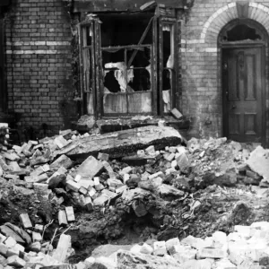Bomb damage in Liverpool. A large crater in Stevenson Street, Liverpool