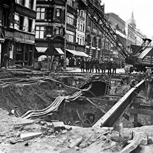 Bomb damage being repaired on The Charing Cross Road, near Manette St, London