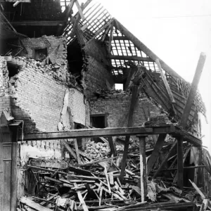 Bomb damage in Wavertree Road, Liverpool. This shop and house was the victim of a direct