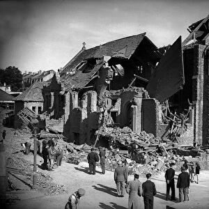 Bomb damaged Plymouth during WW2, People survey the damage left after an air raid