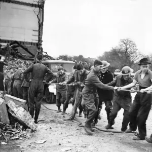 A bombed school near London. Helpers form a change A bombed school near London. Helpers form a change