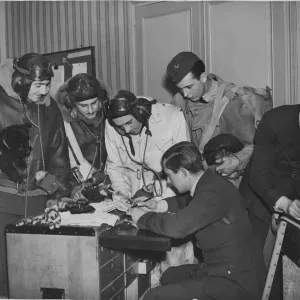 Bomber crews receiving instructions in their squadron flight office, some where in France Bomber crews receiving instructions in their squadron flight office, some where in France