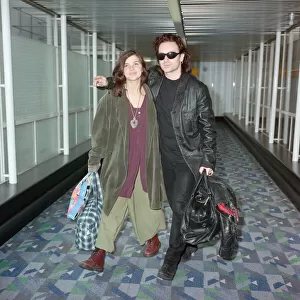 Bono of rock group U2 and his wife Ali pictured at London Airport. 10th October 1991