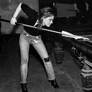 Boogie band leader and singer / guitarist Suzie Quatro, pictured playing snooker at