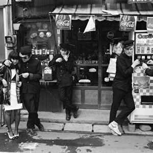 The Boomtown Rats in Tokyo, some of the group members pictured outside a Tokyo shop