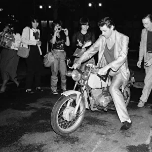The Boomtown Rats in Tokyo. Pictured, singer Bob Geldof on a motorbike