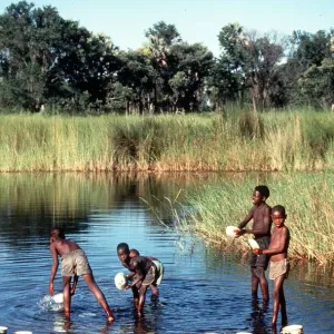 Botswana children wash in the Okauango Delta Msi