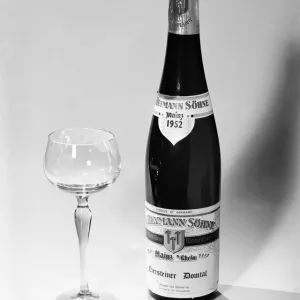 Bottles of wines and spirits with glasses. 1959 D69-003