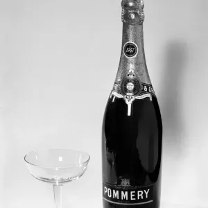 Bottles of wines and spirits with glasses. 1959 D69-004