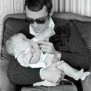 Boxer Alan Minter pictured at his Crawley Sussex home with his six month old baby