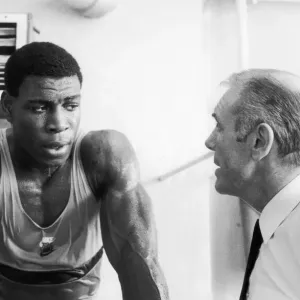 Boxer Frank Bruno with his trainer. 22nd April 1984 Boxer Frank Bruno with his trainer. 22nd April 1984