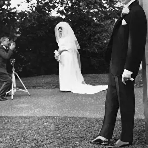 Boxer Ken Buchanan poses for the press during his wedding whilst his wife Carol poses for