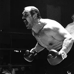 Boxer Lenny "Lean Mean"McLean in the boxing ring prepares for battle