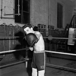 Boxer Roy Bennett practicing in the ring before a fight. November 1953 D6744