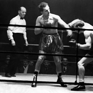Boxers battle it out at St. James Hall, Newcastle. Stan Hawthorne standing