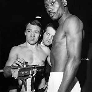 Boxing Belle Vue. Dave Charnley checks the scales for Joe Brown at the weigh in at