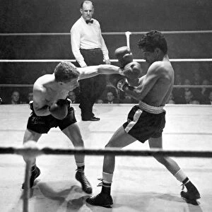 Boxing at Free Trade Hall, Manchester. Jackie Brown lands a left to the face of