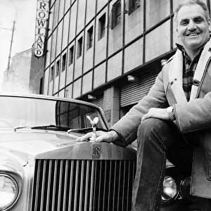 Boxing promoter Alex Morrison standing next to Rolls Royce outside the Barrowlands in