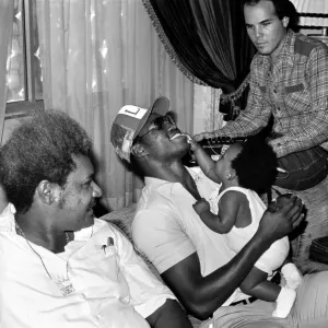 Boxing promoter Don King (left) seen here with Larry Holmes (centre