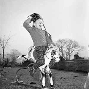 A boy and his best friend. Peter Hallett aged 4 seen here playing cowboys