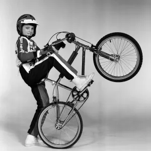 A boy with a BMX bike and wearing a BMX outfit. 25th November 1983 A boy with a BMX bike and wearing a BMX outfit. 25th November 1983