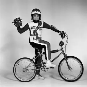 A boy with a BMX bike and wearing a BMX outfit. 25th November 1983 A boy with a BMX bike and wearing a BMX outfit. 25th November 1983