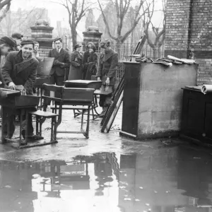 Boys engage in salvage work from a burnt out school in Cardiff after an attack by Nazi Boys engage in salvage work from a burnt out school in Cardiff after an attack by Nazi