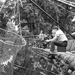 Boys fishing in Battersea Park 7th August 1963