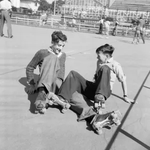 Two boys having a little trouble getting to their feet after a fall at the Winter Garden Two boys having a little trouble getting to their feet after a fall at the Winter Garden