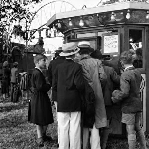 Boys at Henley queue to look at "what the butler saw machine". July 1953 D3393