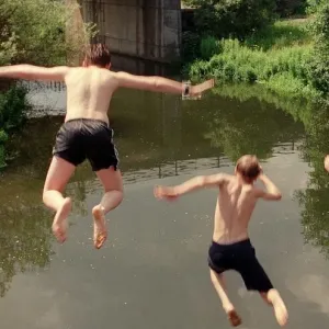 Boys jumping from bridge into water July 1997 Boys jumping from bridge into water July 1997