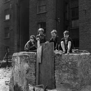 Boys playing at Clydesdale Road adventure playground. 18th May 1955 Boys playing at Clydesdale Road adventure playground. 18th May 1955