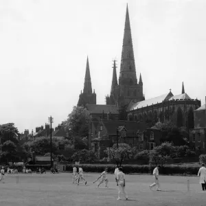 Boys playing cricket in the shadow of Lichfield Cathedral at St Boys playing cricket in the shadow of Lichfield Cathedral at St