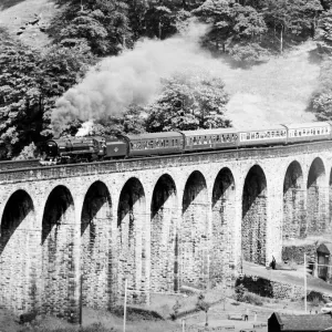 BR standard class 7 steam locomotive 70013 Oliver Cromwell crosses Lydgate viaduct