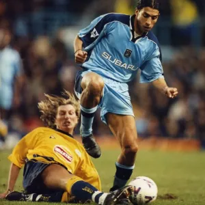 Breaking away: Youssef Chippo is challenged by Robbie Savage Breaking away: Youssef Chippo is challenged by Robbie Savage