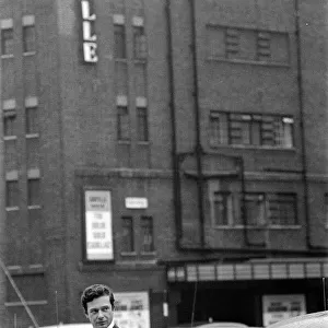 Brian Epstein pictured outside The Saville Theatre, Shaftsbury Avenue, London
