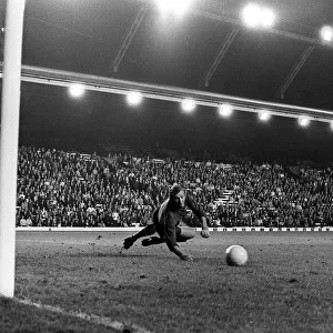 Brian Kidd scores for Manchester United past Bob Wilson of Arsenal at Anfield