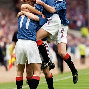 Brian Laudrup Rangers football player is mobbed by skipper Richard Gough