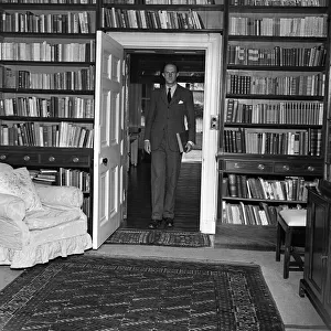 Brigadier Fitzroy Maclean in the book lined study of his home in Yealand Conyers
