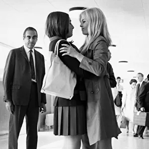 Brigitte Bardot French actress embraces friend 1966 Couturier Helene Vager at
