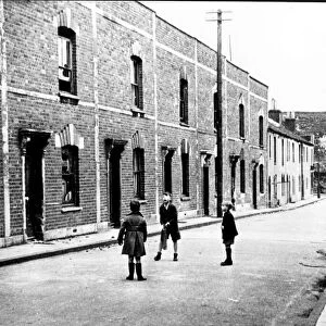 Bristol children playing cricket in the street in Barton Hill during the war