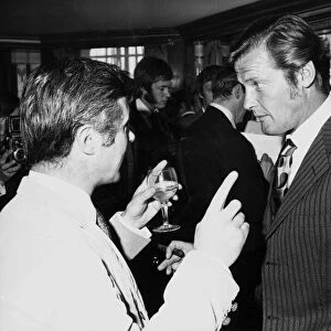 British actor Roger Moore July 1970 chatting with Bryan Forbes Associated